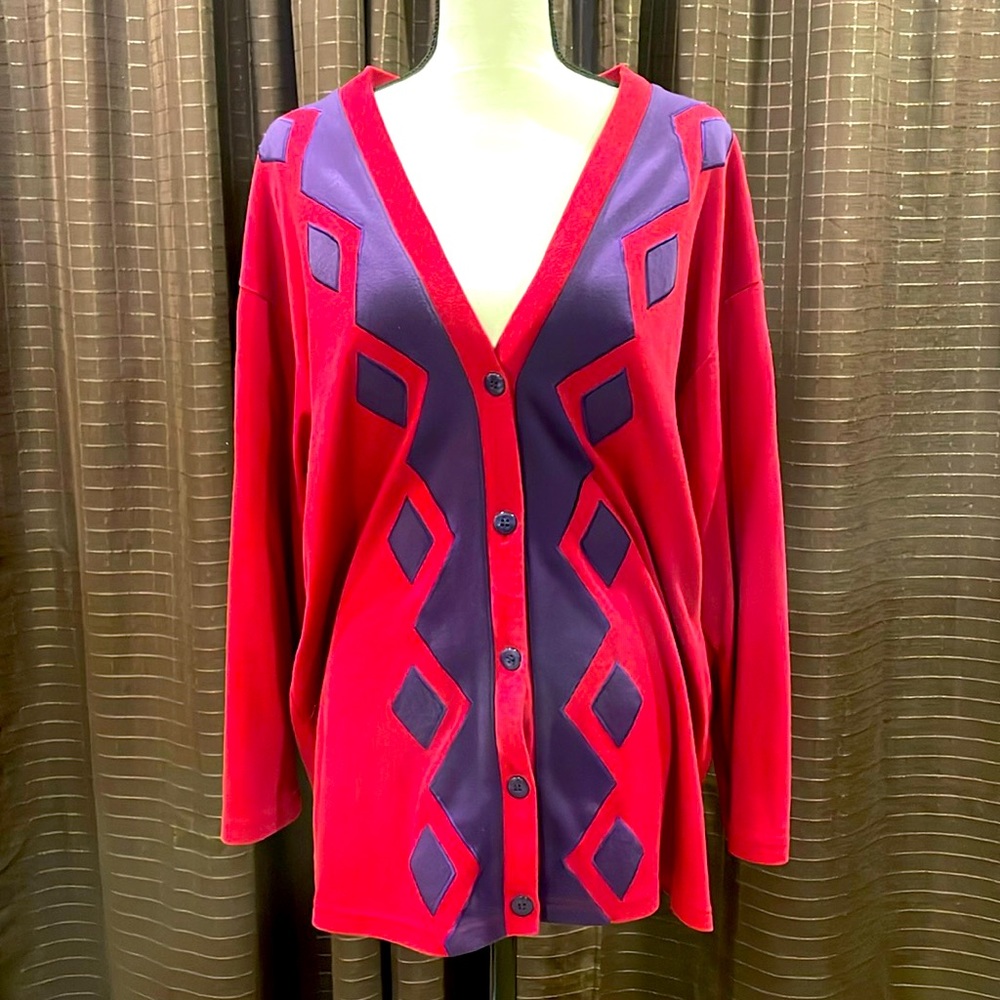 Red cardigan sweater with purple diamond accents.